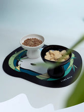 black-and-white-kamamuta-mushroom-bowl-and-bamboo-pet-and-owner-placemat-on-white-floor